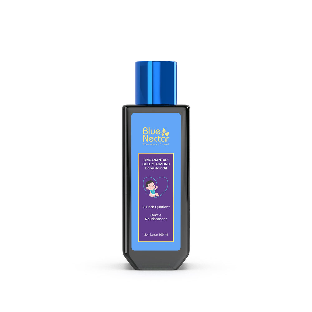 Blue Nectar baby hair oil packaging closeup with organic ingredients and safety labeling.