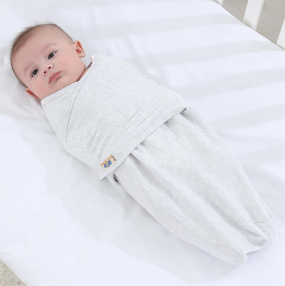 BlueSnail swaddle with adjustable closure demonstrates easy, secure fit for soothing newborns