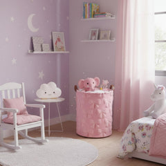Blushtier pink bow laundry basket full of blankets and clothing