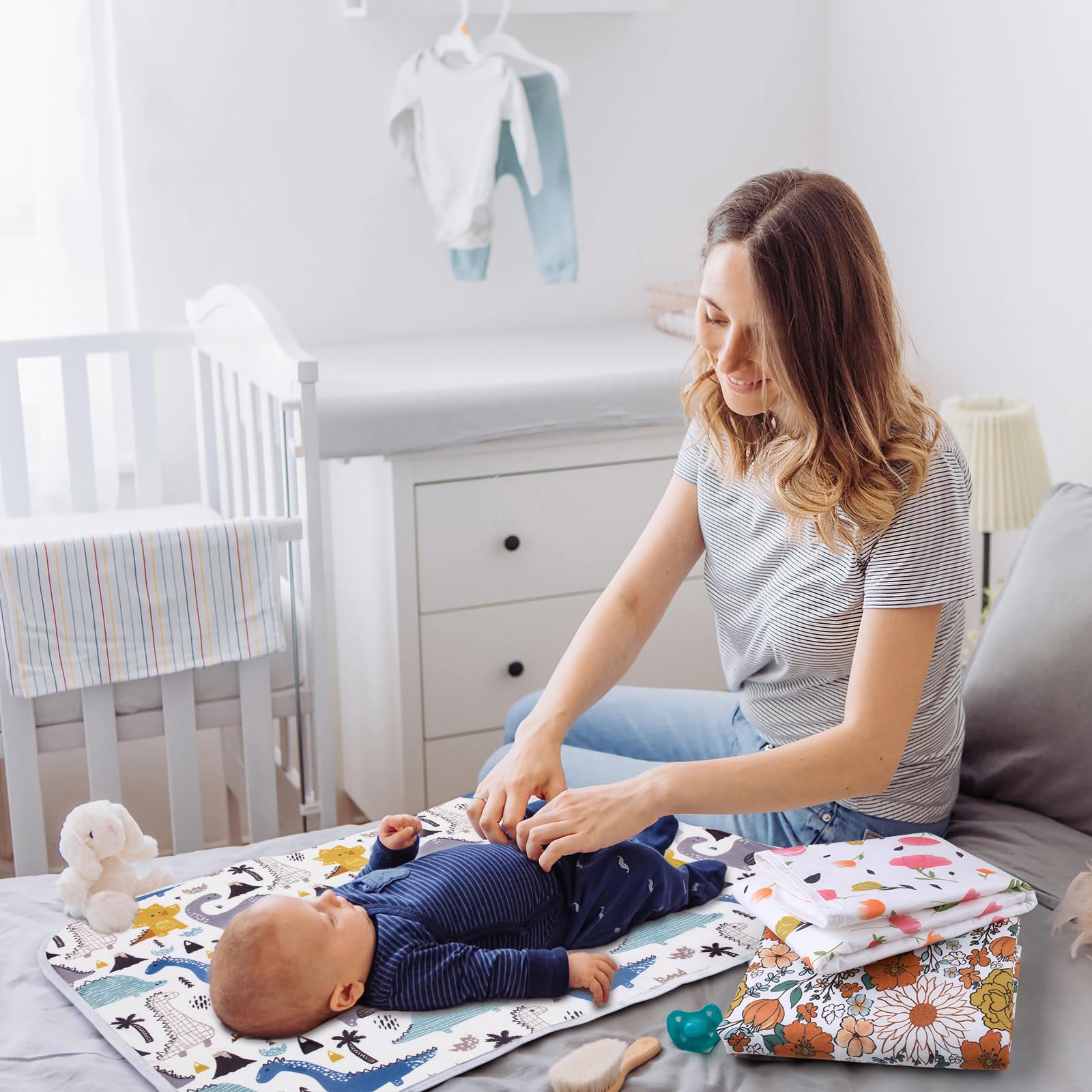 Bnditeu portable changing pad in travel-ready design with purple flowers.