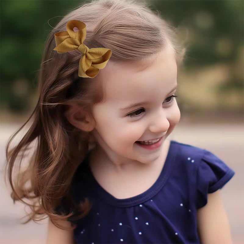Boenbe Loved baby girls hair accessory pinwheel bow in dark blue for cute styling.