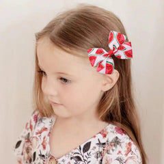 BOENBE LOVED watermelon bow hair clip closeup highlighting smooth finish and secure grip.