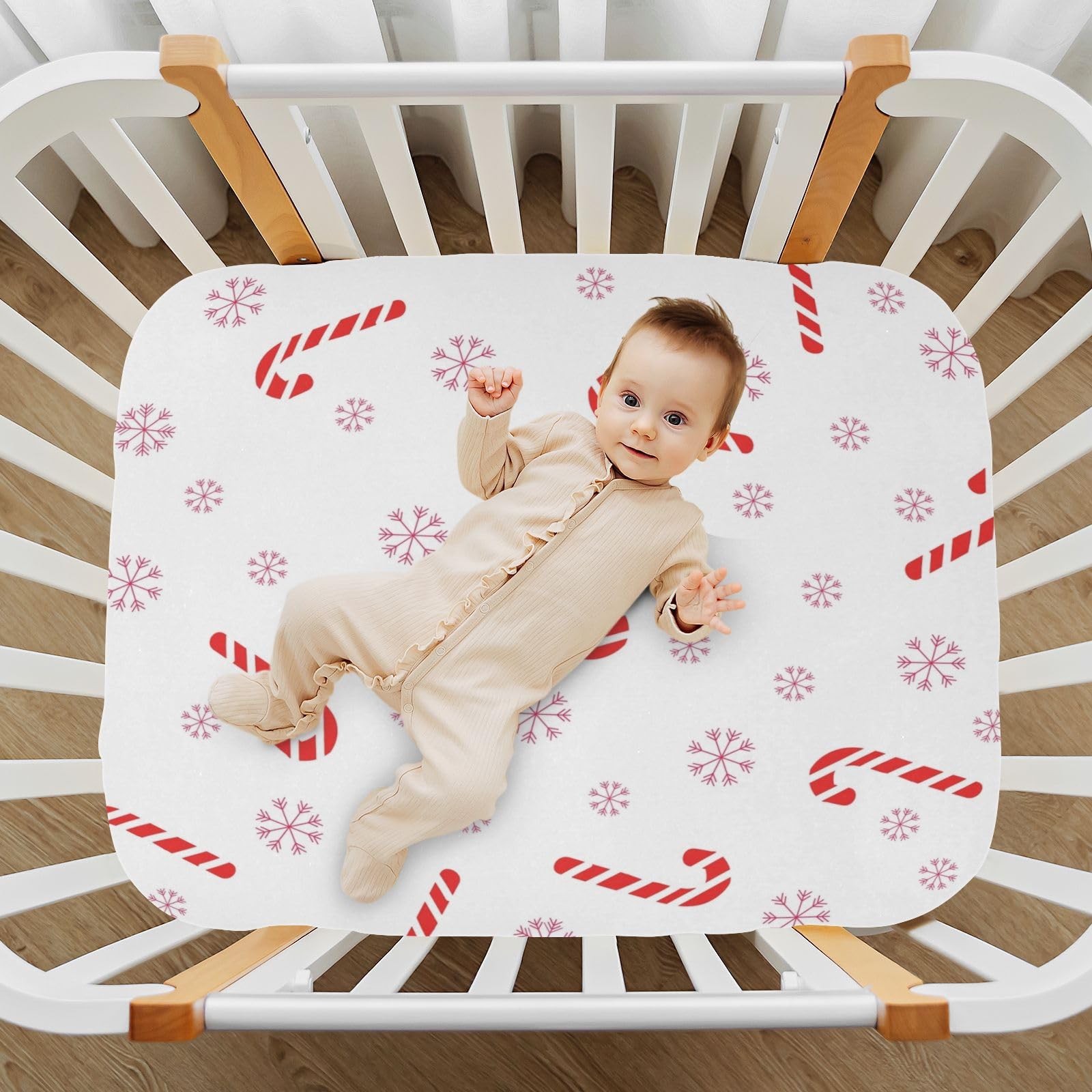 Festive Christmas Cane Candy pattern on BOESI crib sheet adds nursery charm