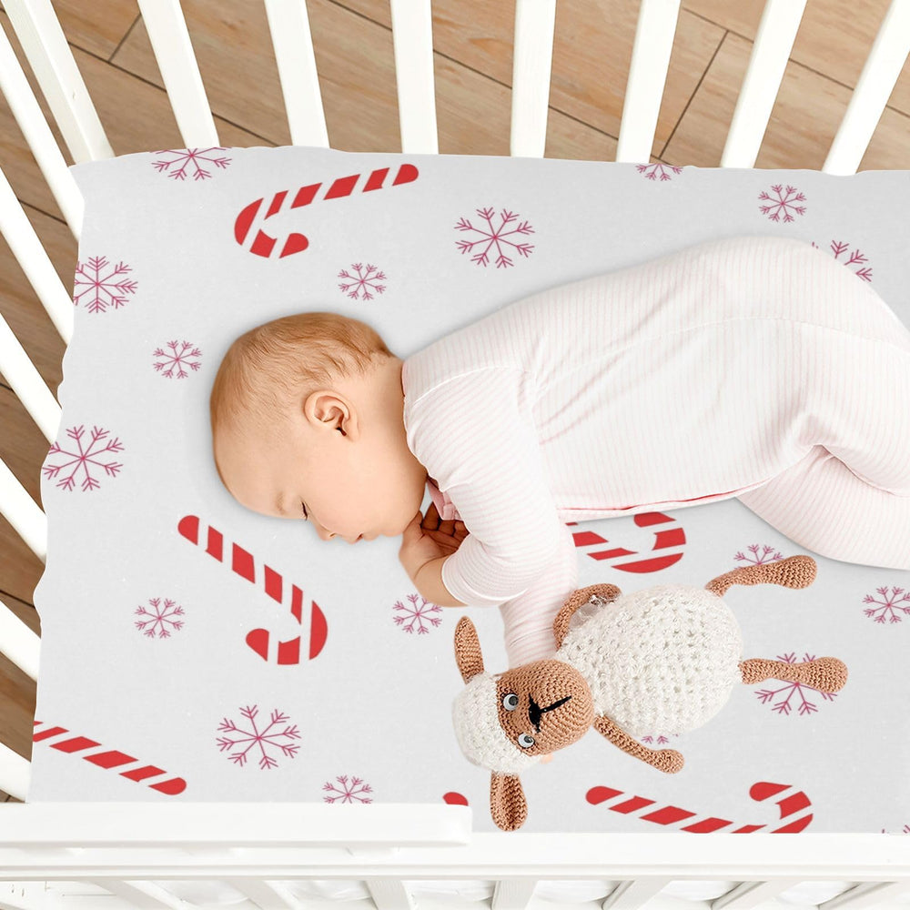 BOESI crib sheet in a nursery setting with gift-ready presentation