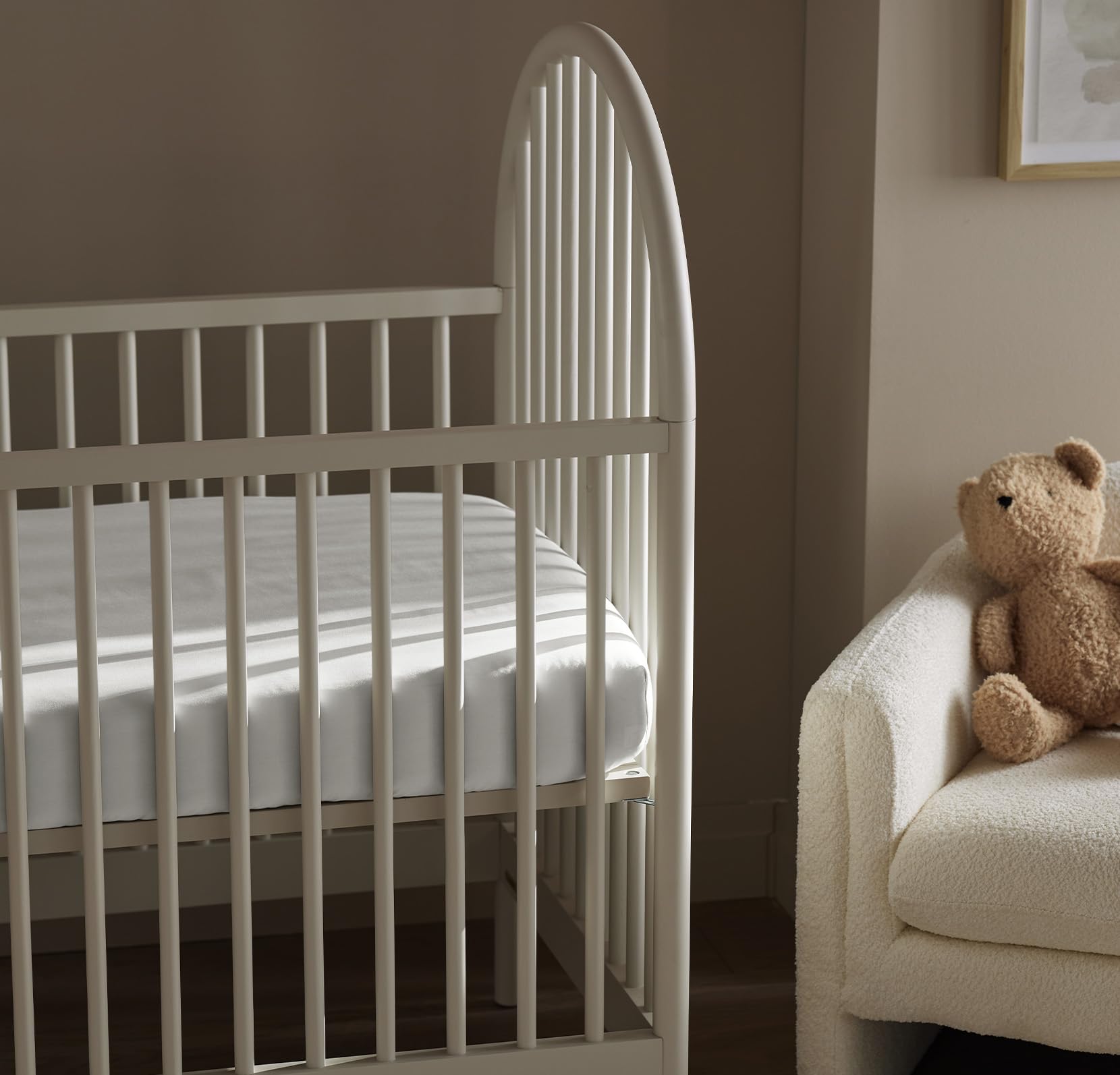 Boll & Branch durable fitted sheet edge stitch test on crib mattress