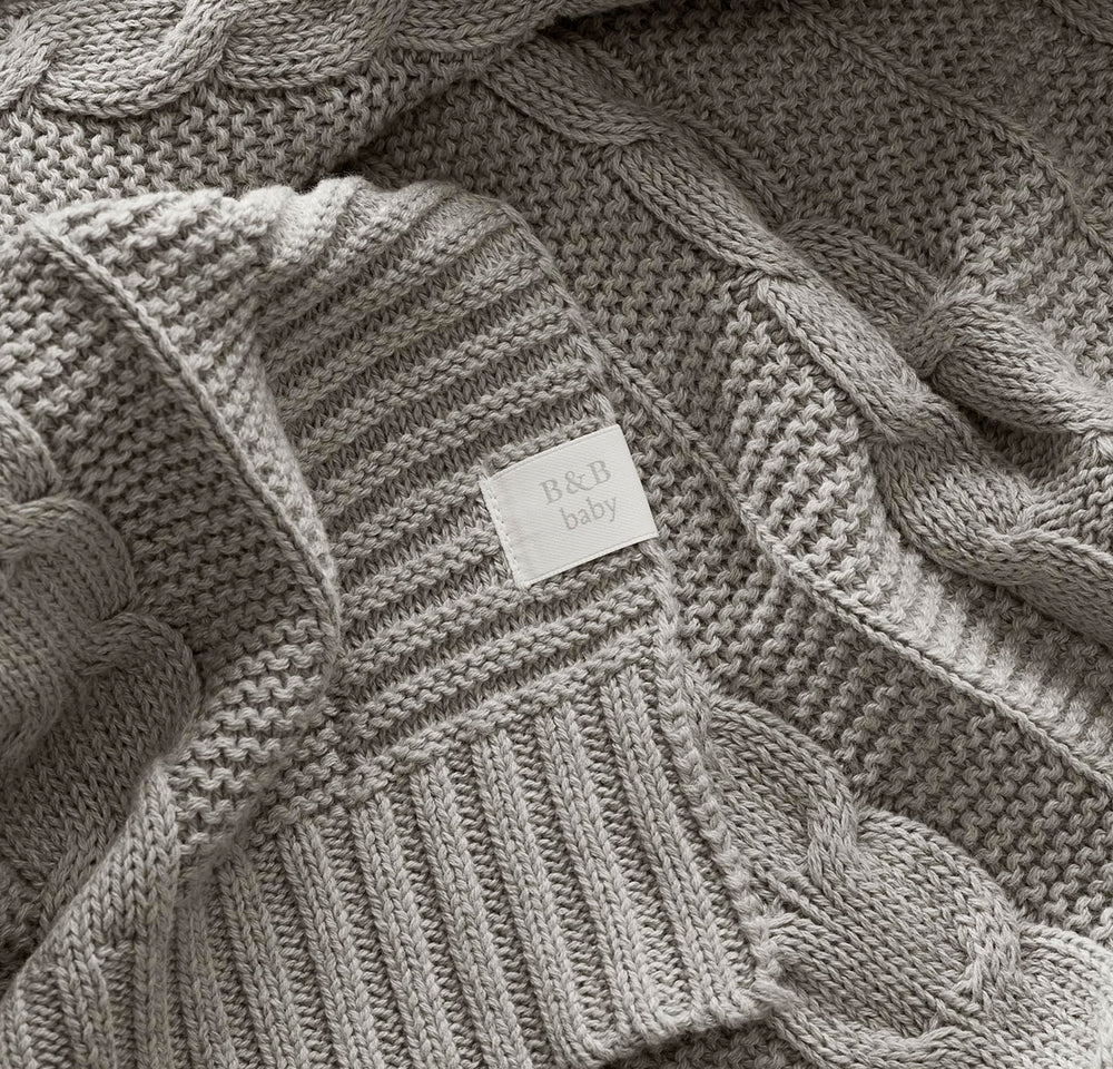 Boll & Branch machine-washable baby blanket draped for easy care after messes
