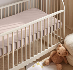 100% organic cotton Boll & Branch crib sheet offering toxin-free, gentle sleep environment for baby.