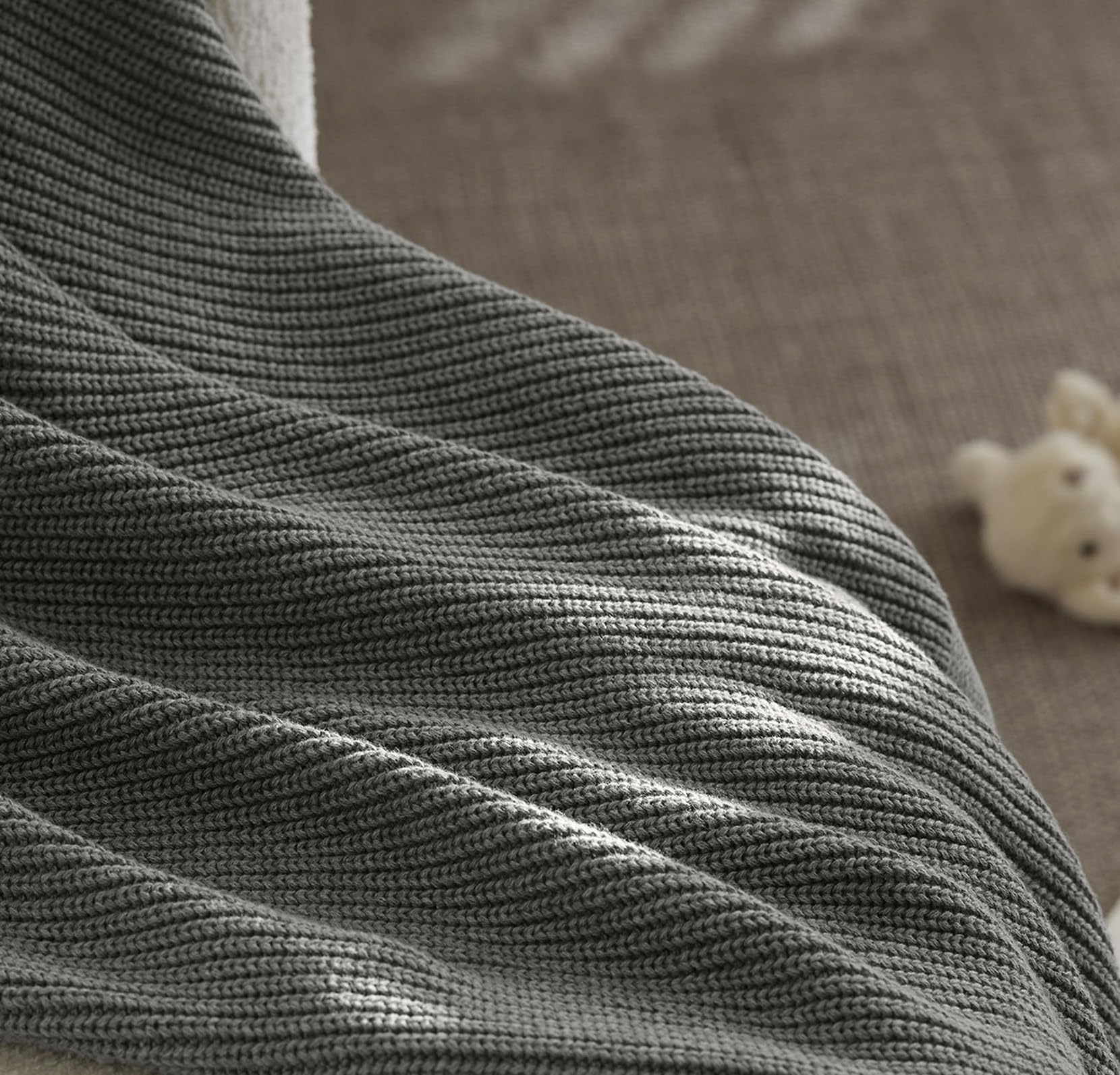Boll & Branch care-friendly blanket image highlights machine washing for busy families.