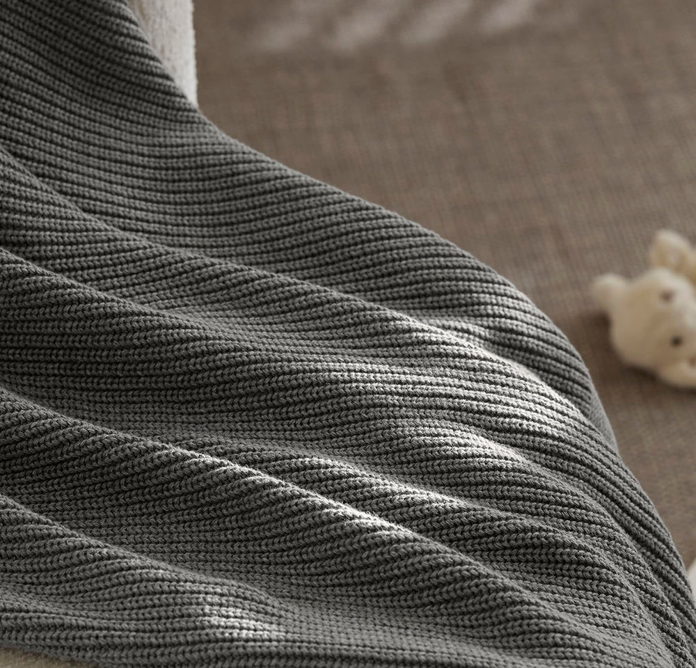 Boll & Branch care-friendly blanket image highlights machine washing for busy families.
