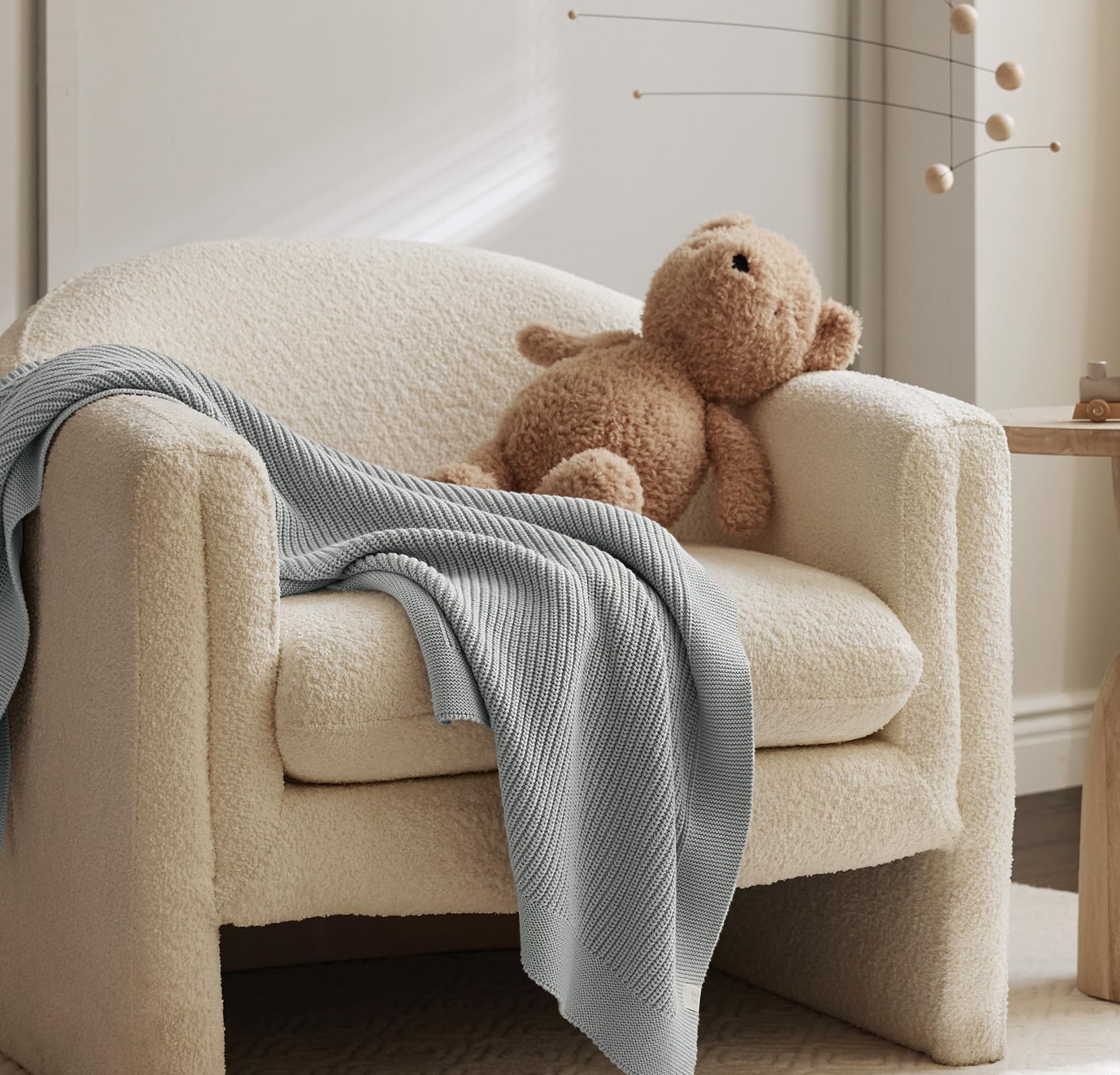 BOLL & BRANCH ribbed knit baby blanket Shore lifestyle shows cozy snuggle moments for baby.
