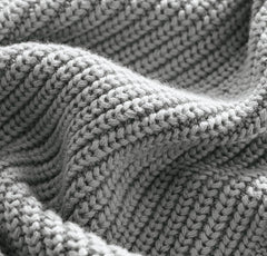 BOLL & BRANCH ribbed knit baby blanket Shore close-up reveals breathable fibers and fine texture.