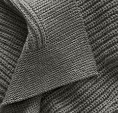 Boll & Branch blanket close-up shows ultra-soft hand feel for comfortable snuggles.