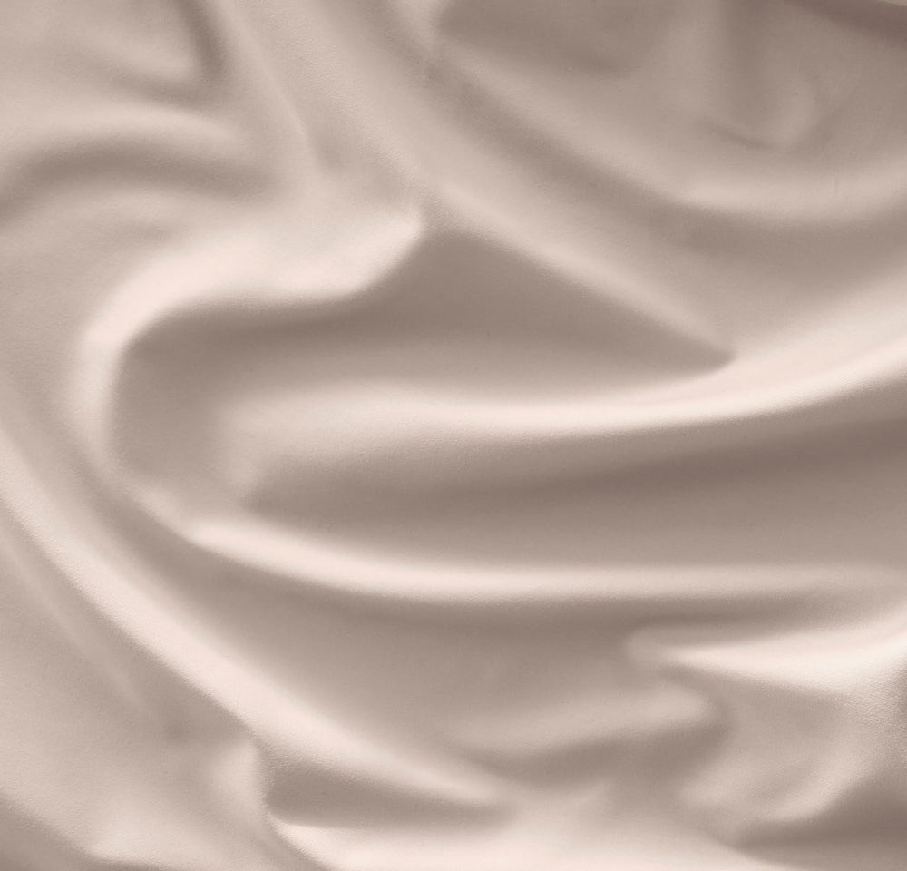 Close-up of the fitted crib sheet showing a secure top-stitched elastic band for snug fit.