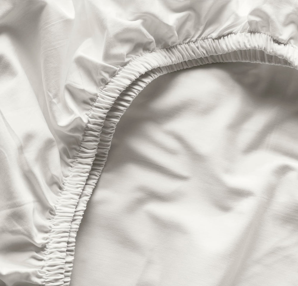 Boll and Branch soft organic cotton crib sheet for a gentle baby sleep.
