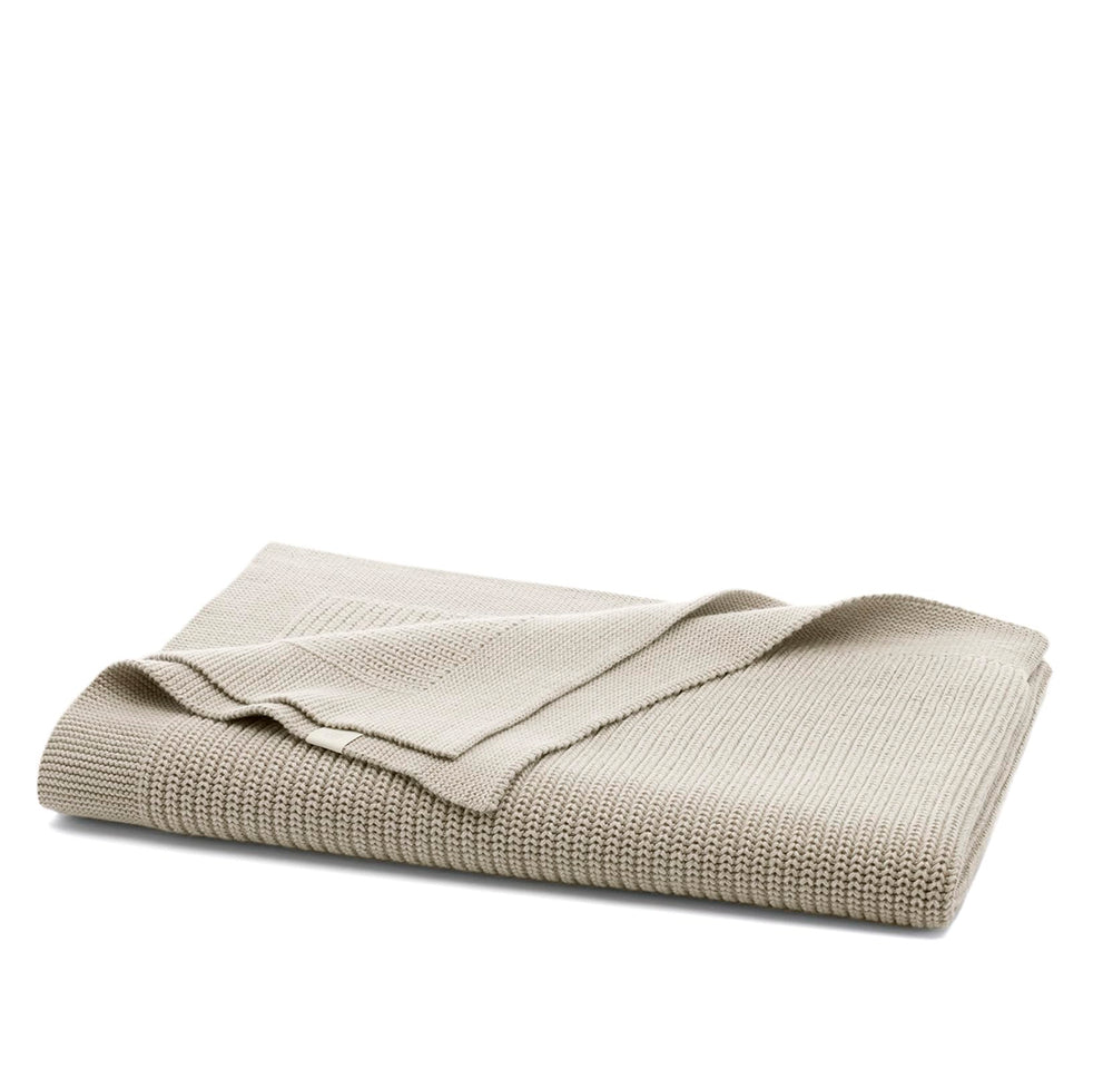 Boll & Branch ribbed knit blanket texture close-up, ultra-soft and breathable.