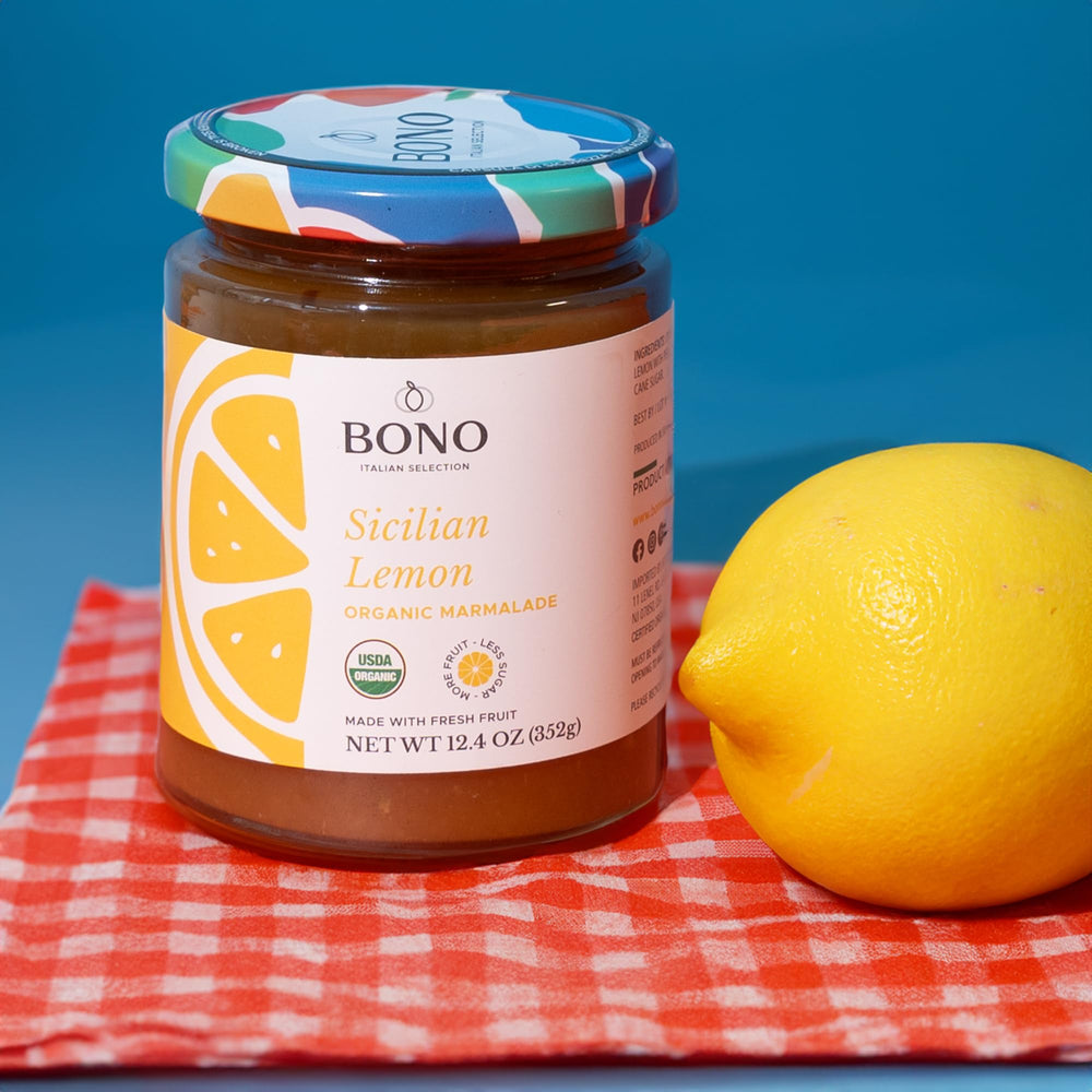 Sliced lemon marmalade on bread, bright and glossy, ready for breakfast.