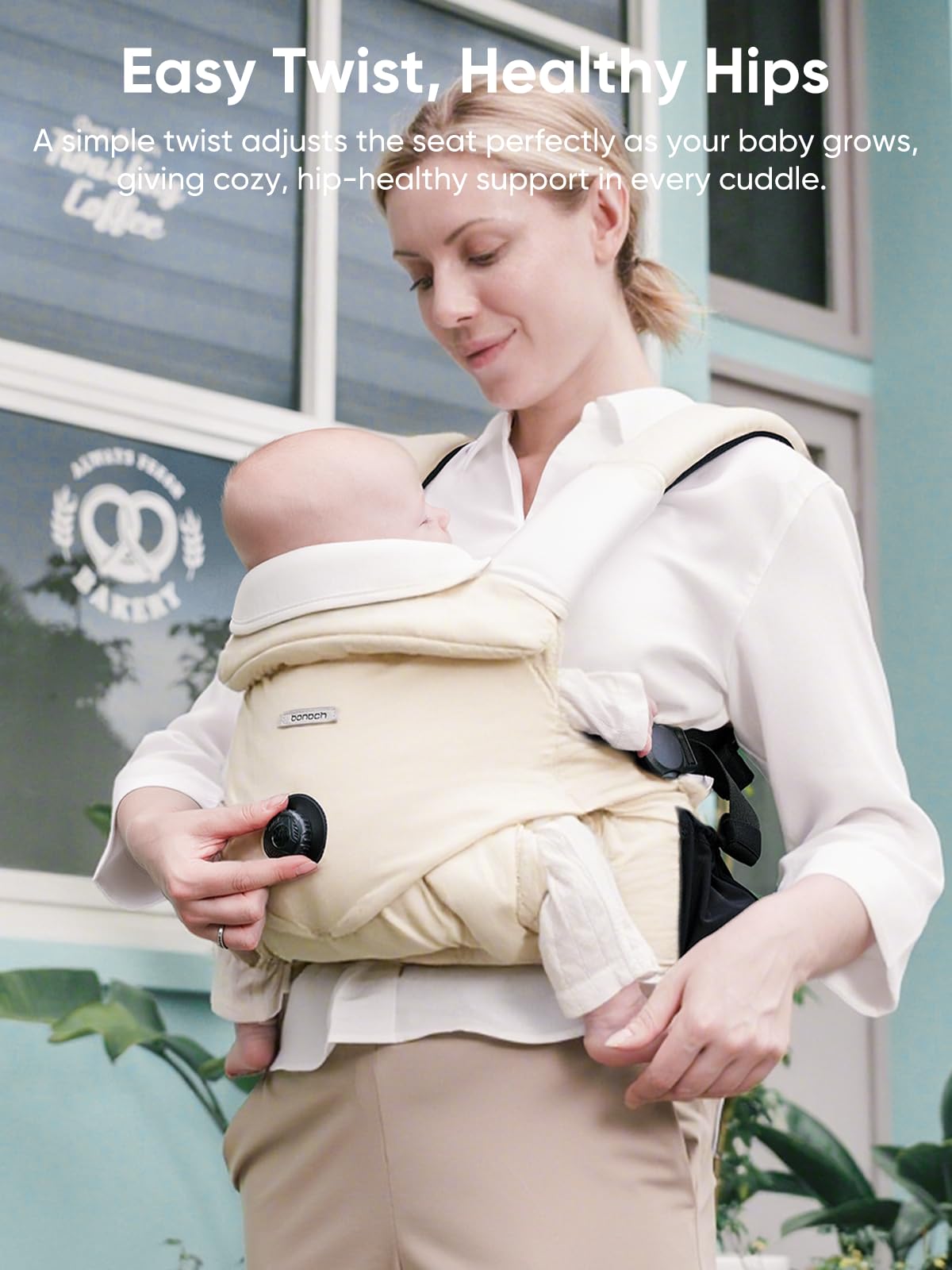 bonoch carrier demonstrates hip-friendly M-shape seating for baby