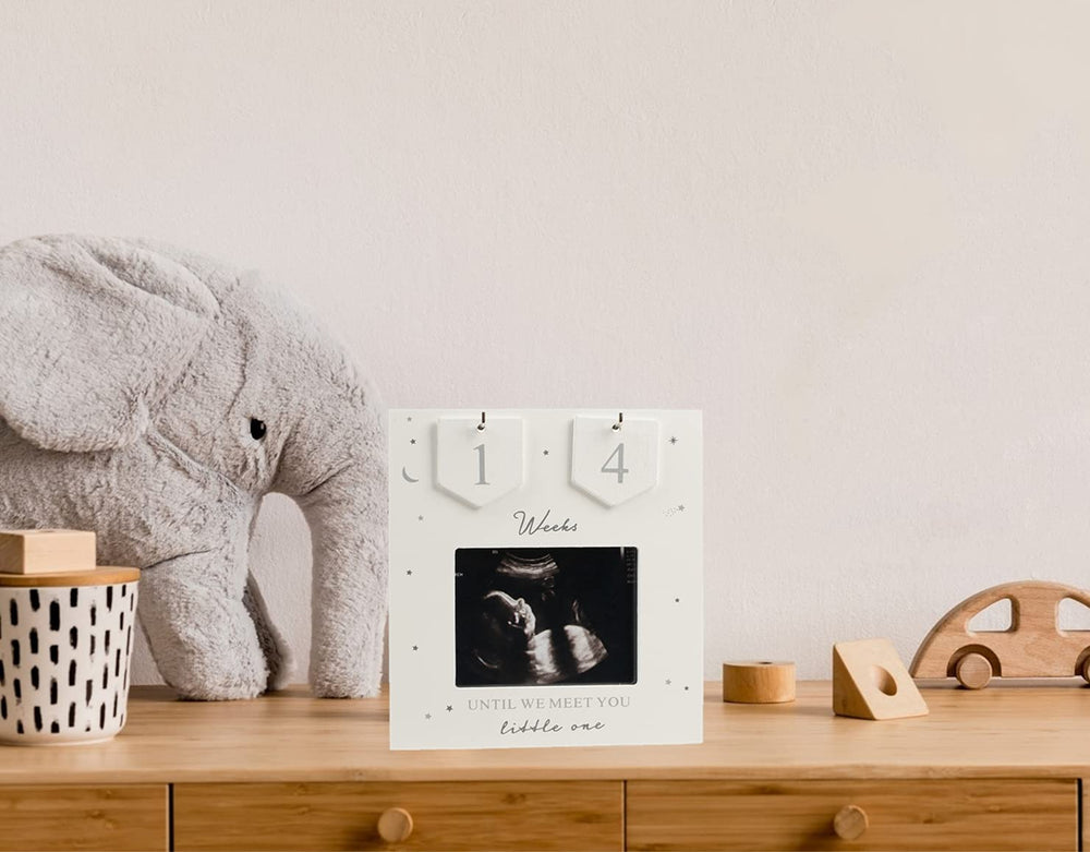 Boom Moments frame with stars and moon accent for cozy nursery decor.