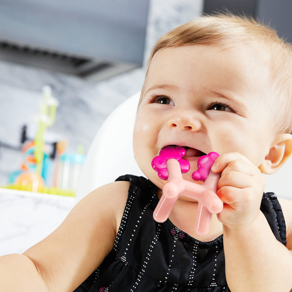 Boon Prance Unicorn Teether being held for easy grip during teething play