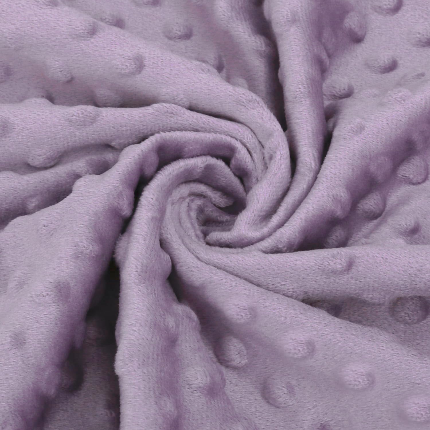 BORITAR blanket in lavender tones complements nursery decor and calm environment.