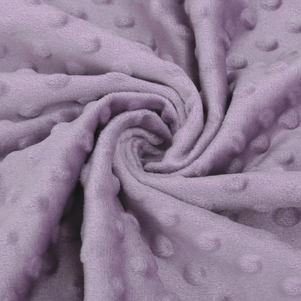BORITAR blanket in lavender tones complements nursery decor and calm environment.