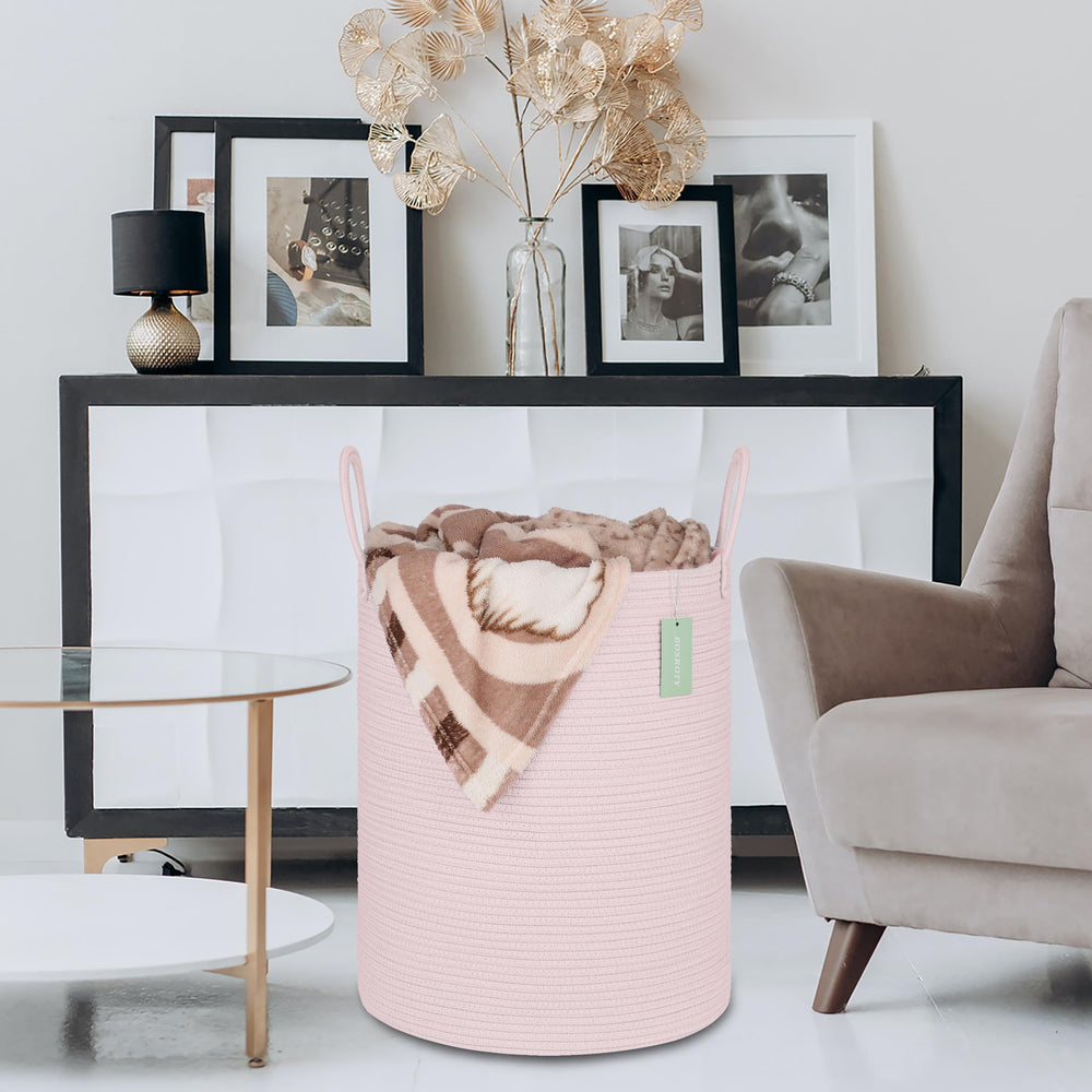 Bosroty blanket and towel storage basket neatly holds throws.