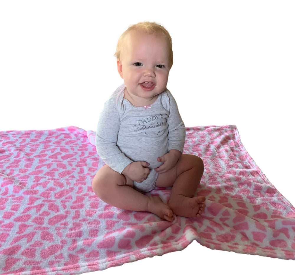 Bozeman Baby Company hooded blanket travel-pillow rolled-hood shows versatile on-the-go comfort.