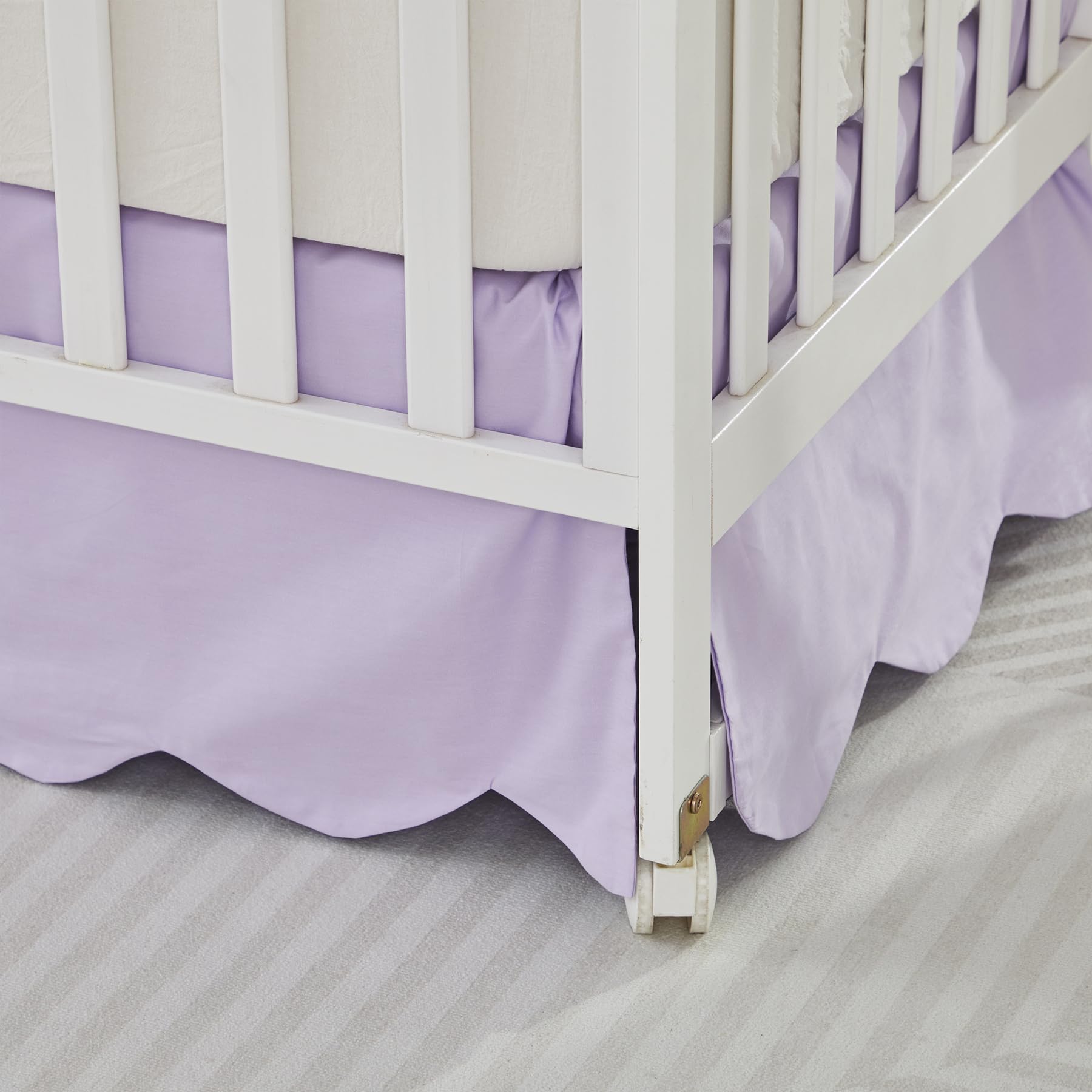 Brandream crib skirt shown on a toddler bed for a seamless transition.