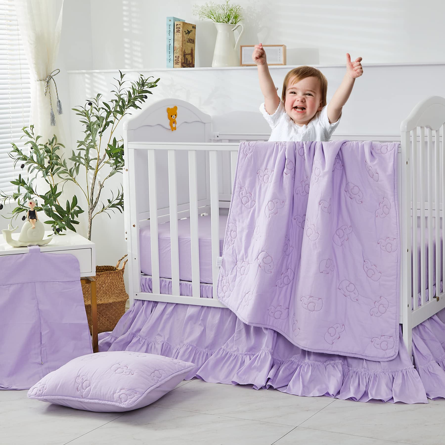 Brandream four-sided bed skirt in purple completes the nursery look with a polished finish.