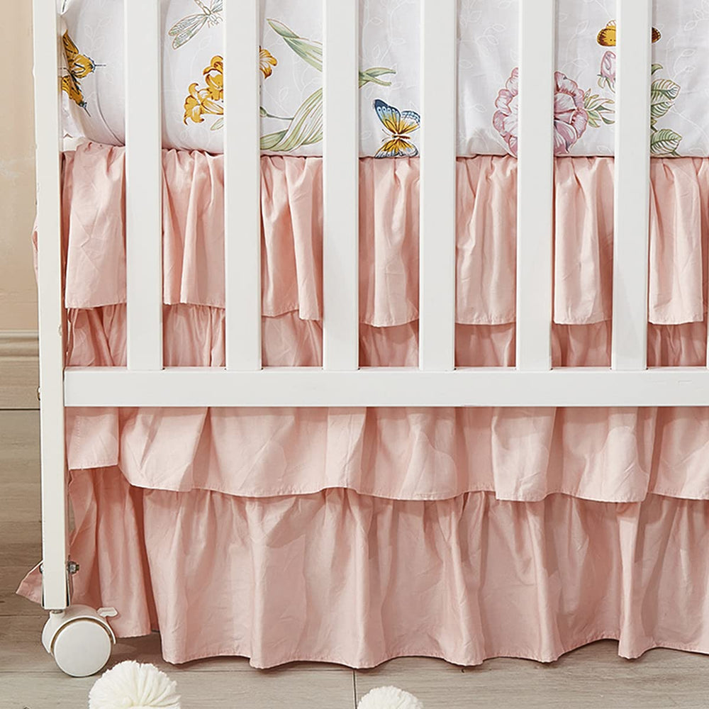 Brandream blush pink crib skirt with ruffles for a charming four-sided fit around a standard crib.
