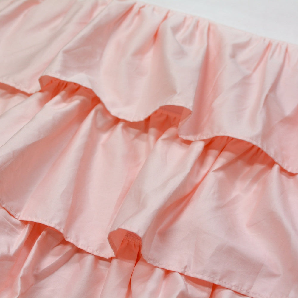 Brandream blush pink triple-layer crib skirt adds depth and cozy feel to nursery.