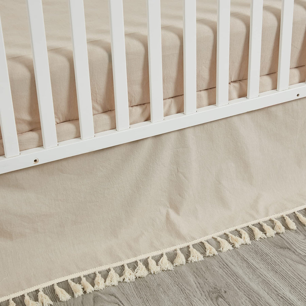Brandream crib bed skirt in beige boho style adds soft texture to the nursery.
