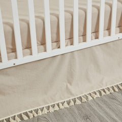 Brandream crib bed skirt in beige boho style adds soft texture to the nursery.