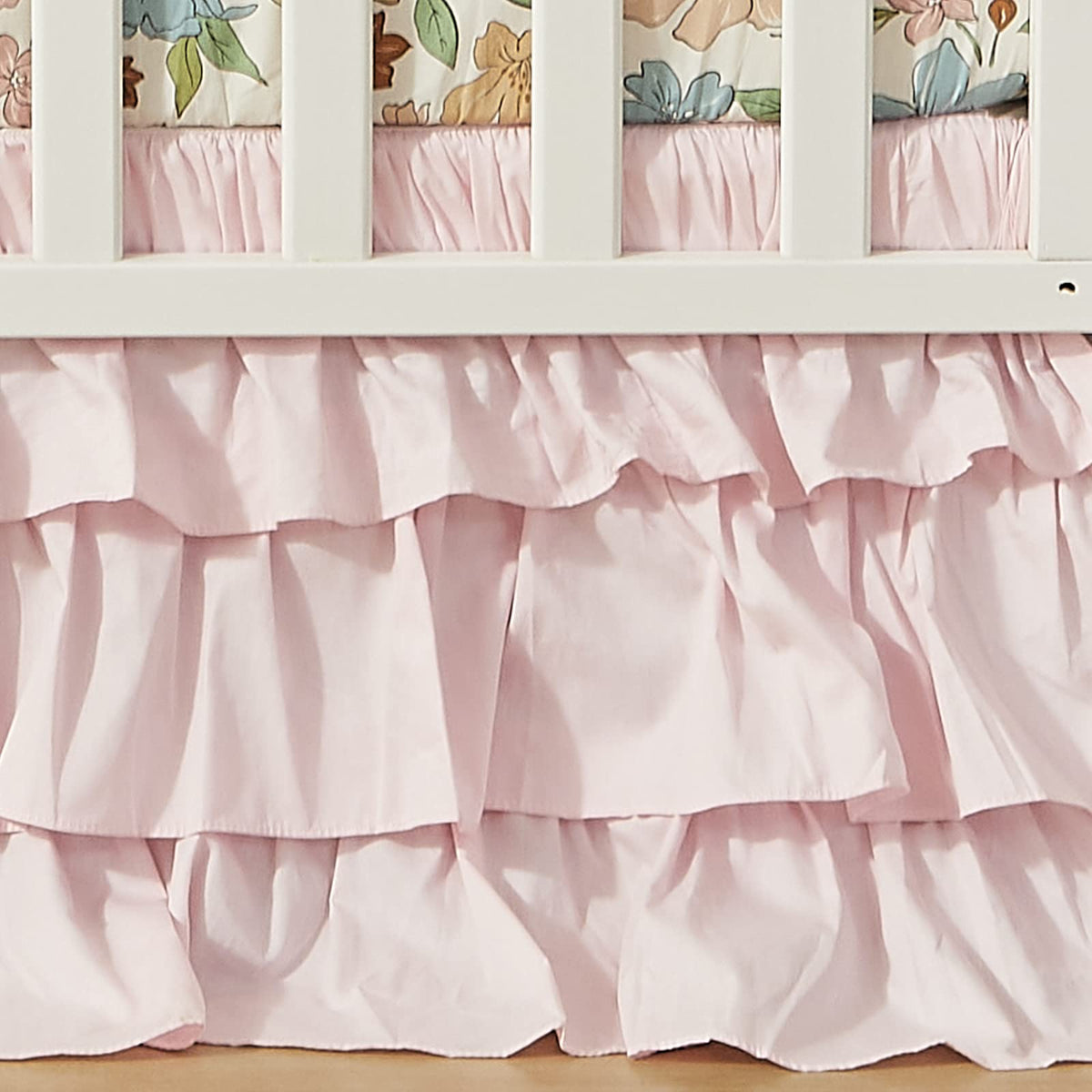 Brandream crib bed skirt in blush pink Boho style adds soft color to nursery.