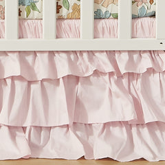 Brandream crib bed skirt in blush pink Boho style adds soft color to nursery.