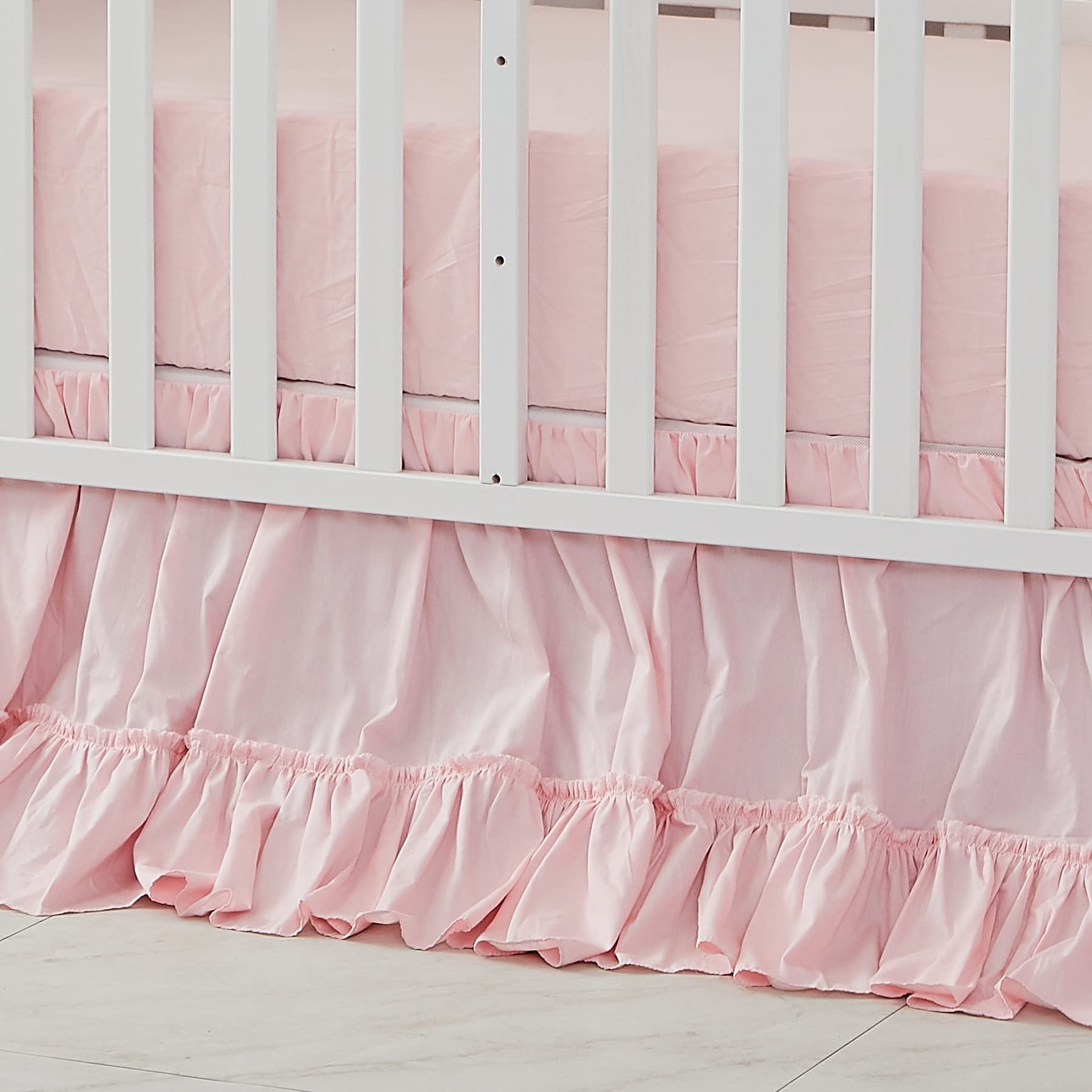 Brandream crib bed skirt in blush pink adds soft nursery color