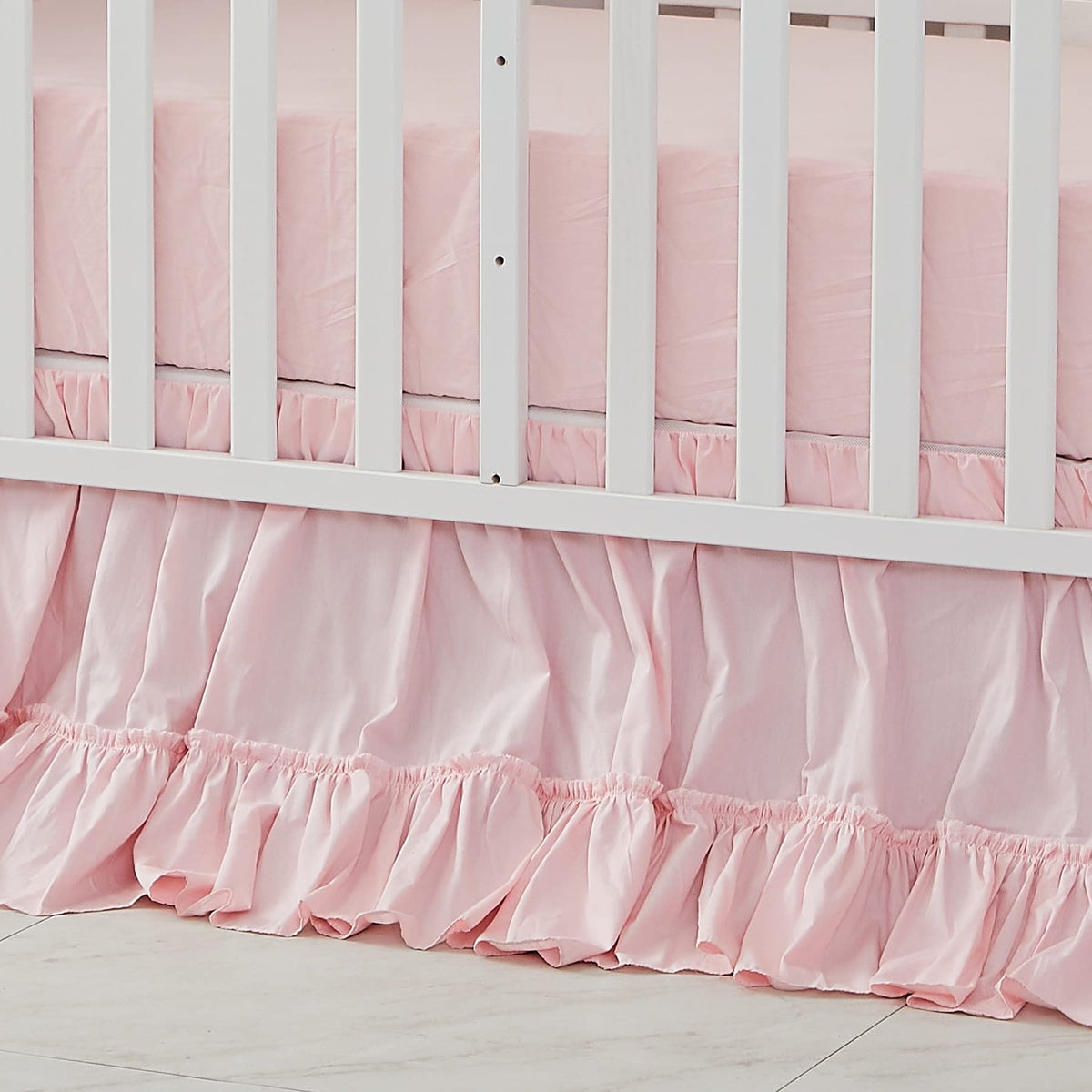 Brandream crib bed skirt in blush pink adds soft nursery color