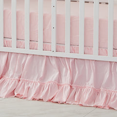 Brandream crib bed skirt in blush pink adds soft nursery color