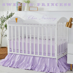 Brandream crib bed skirt on a nursery display in purple Boho style