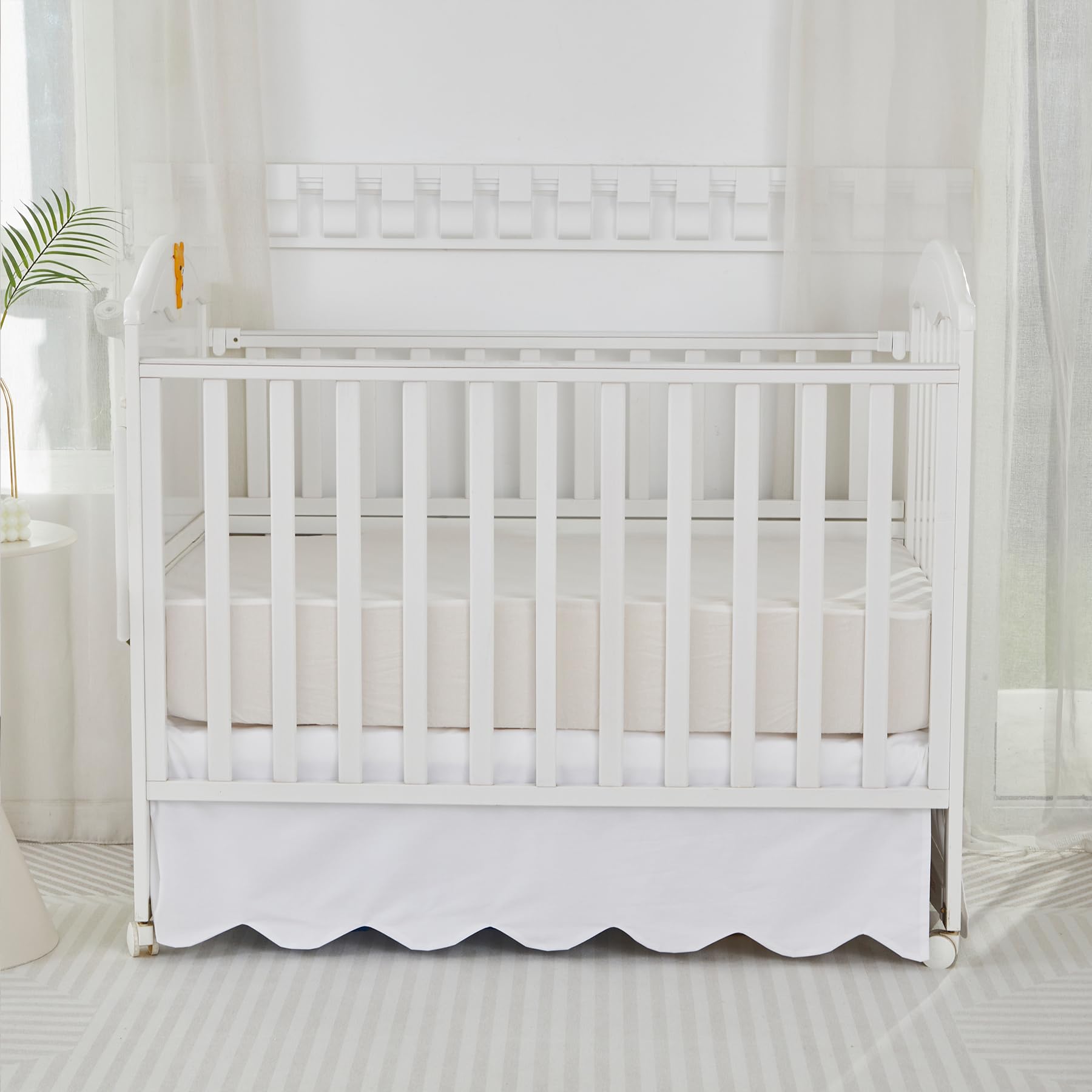 Brandream crib skirt dimensions 52x28x16 inches demonstrated for fit.
