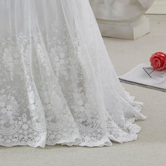 Brandream crib skirt with lace edge in cream adds vintage charm to the nursery.
