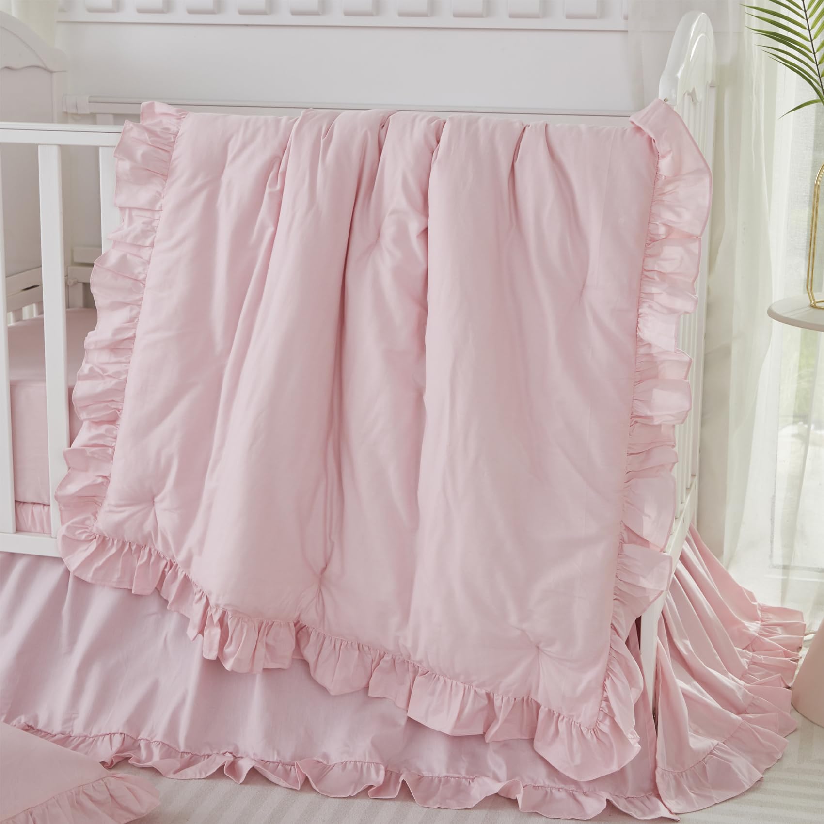 Brandream Farmhouse comforter detail with soft pink ruffles for cozy nursery nights.