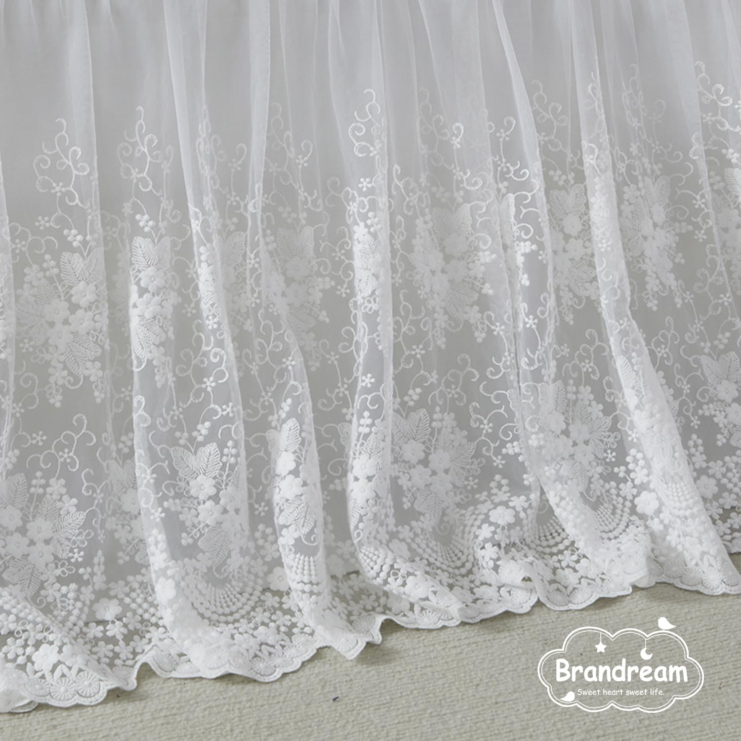 Brandream four sided crib skirt drops 16 inches for a snug fit.