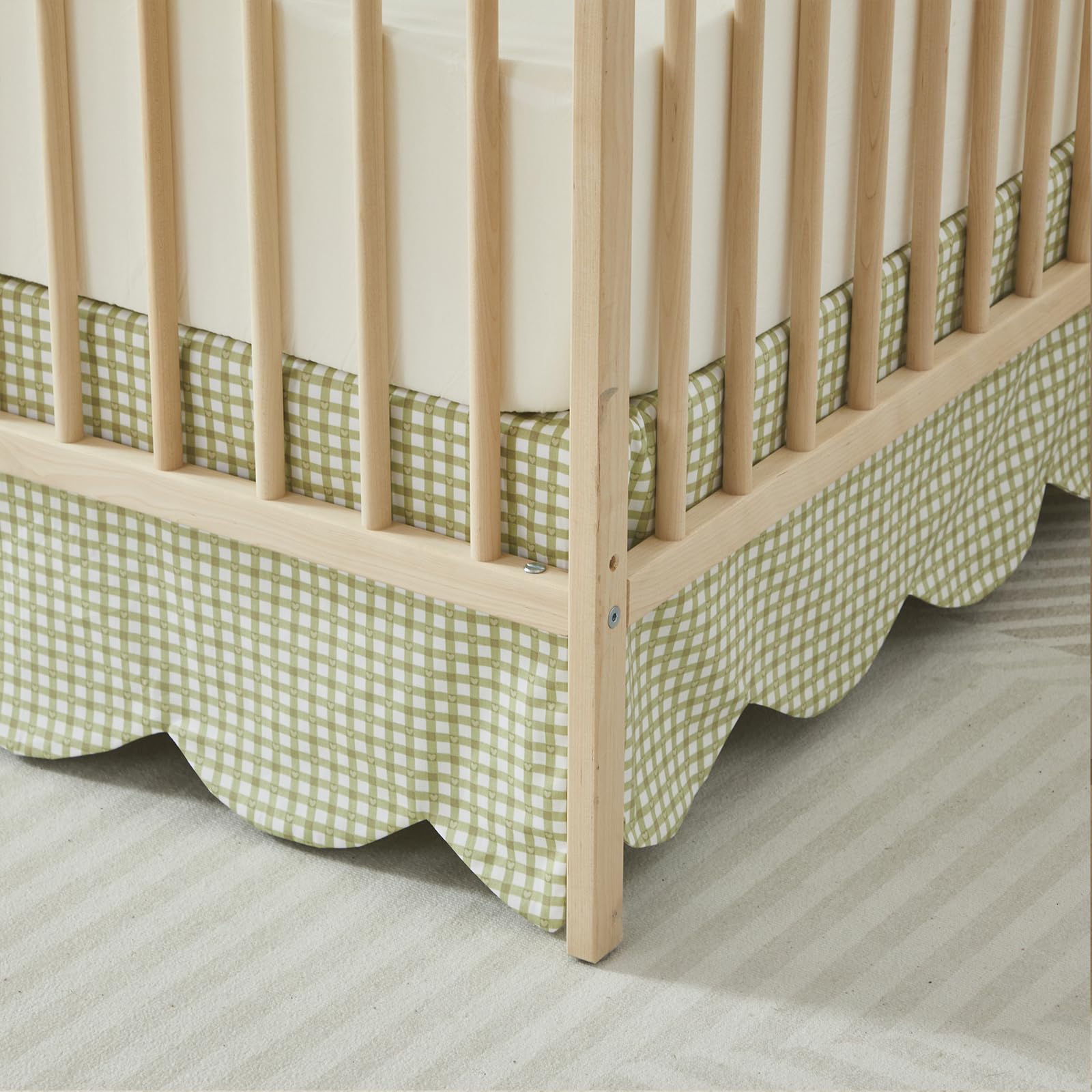 Brandream gender-neutral green gingham crib skirt coordinates with nursery decor.