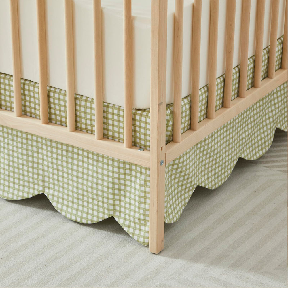 Brandream gender-neutral green gingham crib skirt coordinates with nursery decor.