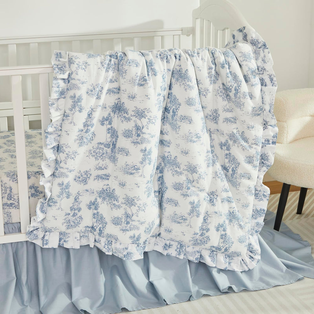 Brandream light-blue nursery skirt complements neutral decor.