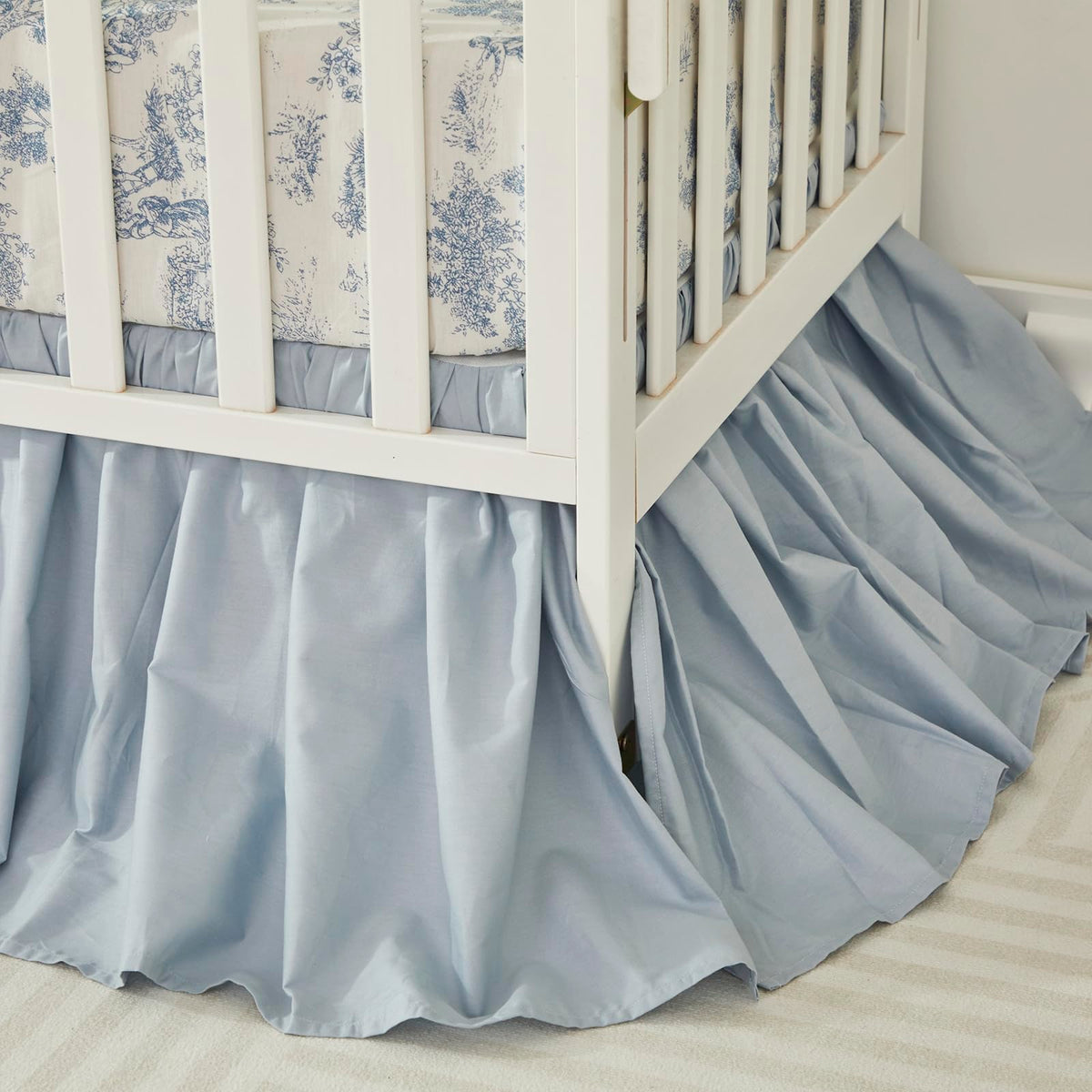 Brandream crib skirt in light blue with a 4-sided drop for easy fit.