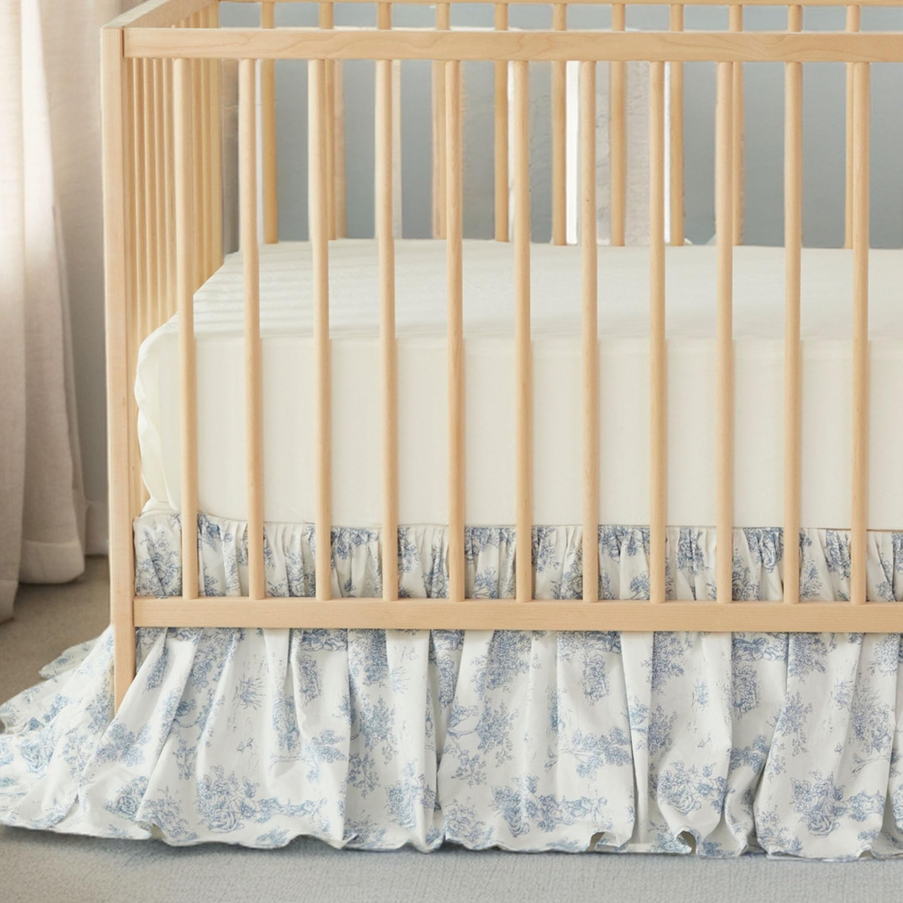 Brandream nursery setup featuring this skirt complements blue decor