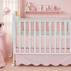 Brandream scallop edge crib skirt closeup shows soft cotton and tidy nursery.