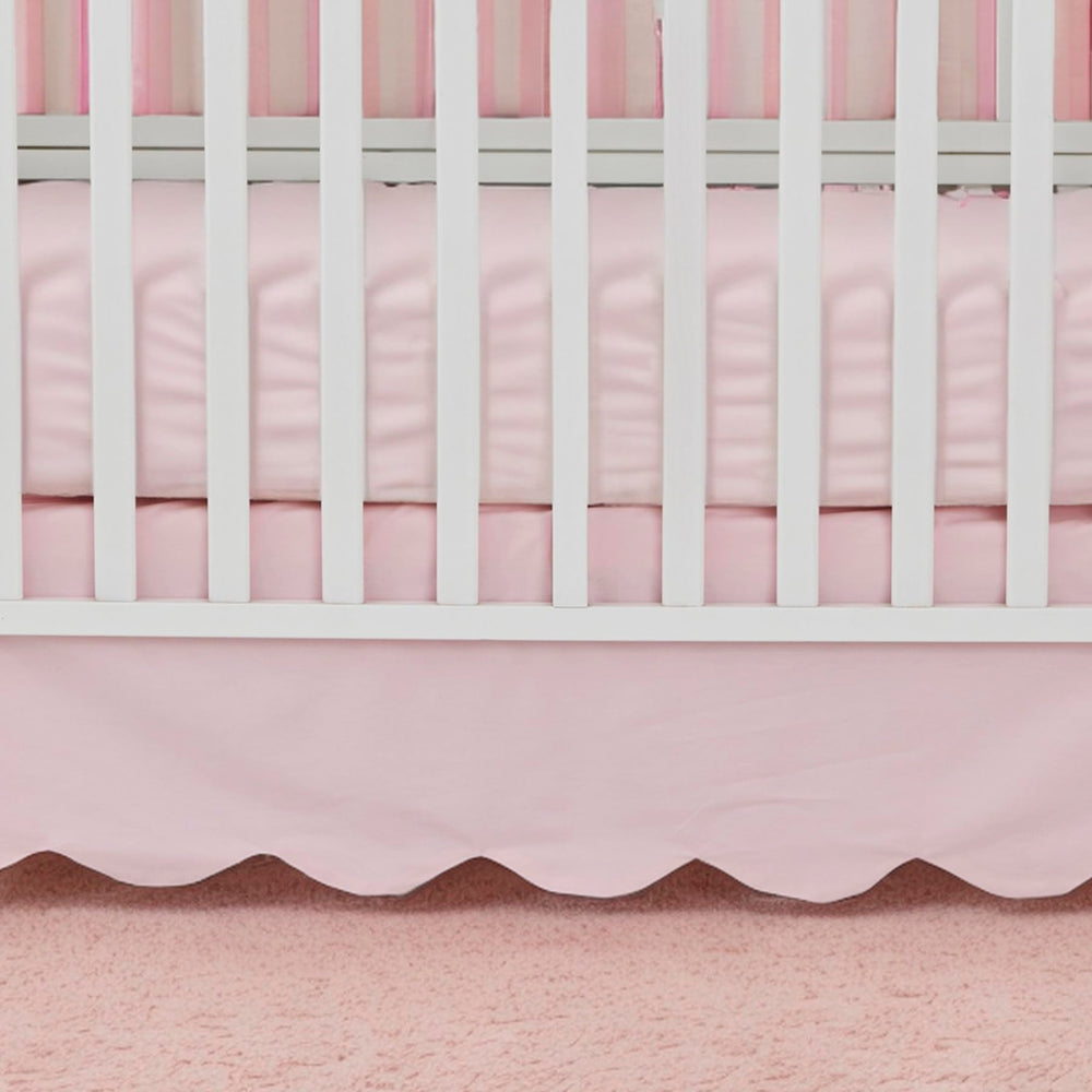 Brandream scallop edge crib skirt draped on crib highlights elegant design for coordinated nurseries.
